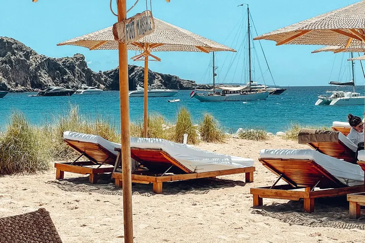 Sun loungers and parasols at an Ibiza beach club
