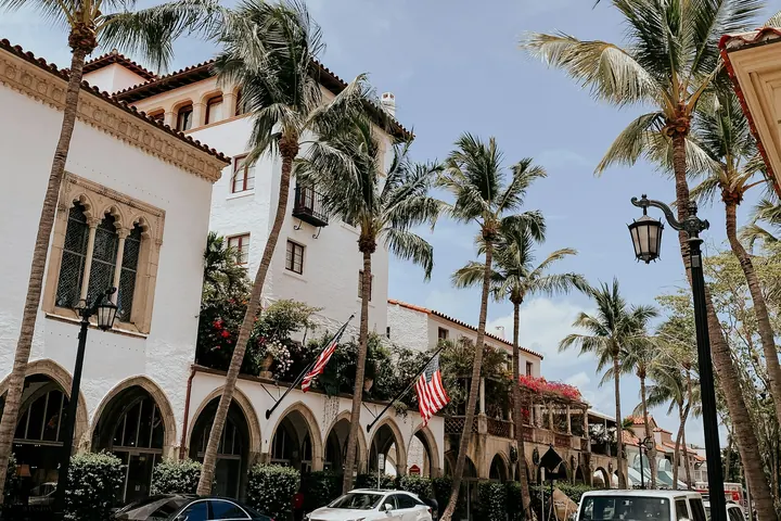 A palm-lined street in Palm Beach on a sunny day